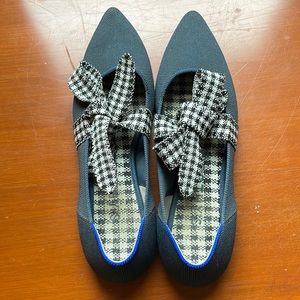 Rothy’s Mary Jane flats in Navy with checkered bow.